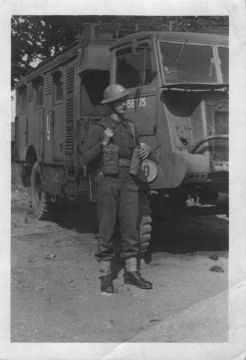 Tad standing guard by his signals collection truck somewhere on the Scottish Coast.