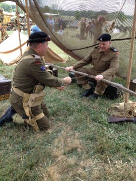 Here we cut another pole for our cammo net. We are proving beyond doubt that a 70-year old British issue chain saw still works quite well. Although it does tend to damage one's fingers when pulling.