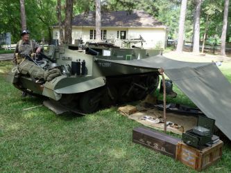 Living accommodations for a carrier crew in the field were sparse to say the least. Here we display typical personal items, rations and makeshift shelter. Sleeping with the smell of oil and grease next to your head is an experience in itself. The mosquitos didn't seem to mind however.