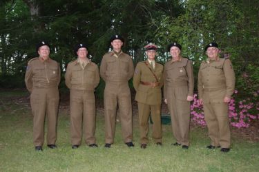 Group photo taken before dinner while we could still mostly fit into our uniforms.